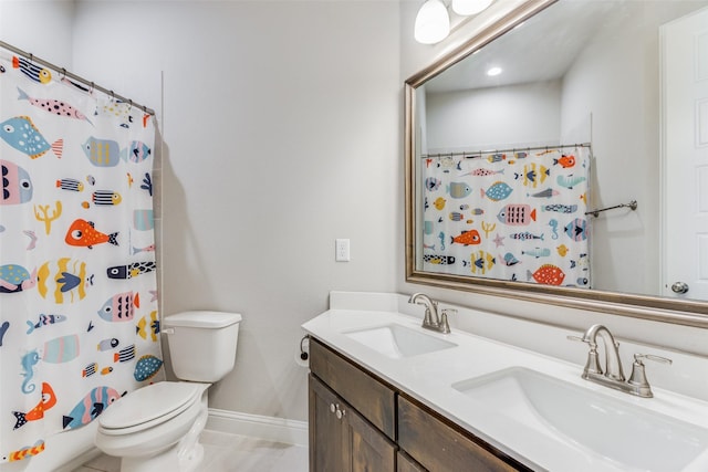 bathroom featuring toilet, tile patterned flooring, vanity, and curtained shower