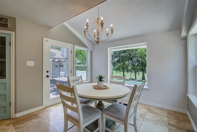 dining area with an inviting chandelier