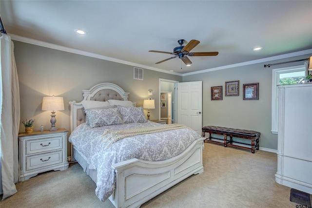 bedroom with ceiling fan, light colored carpet, and crown molding