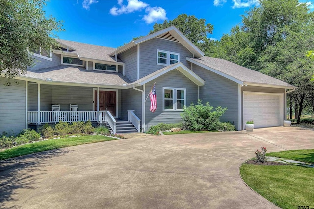 view of front of house featuring a garage and a porch