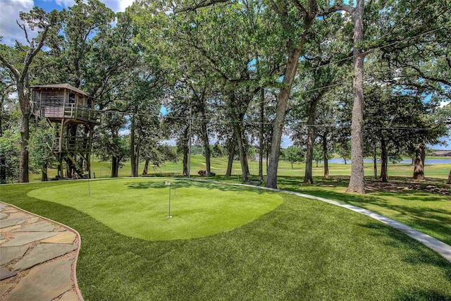 view of property's community featuring a lawn