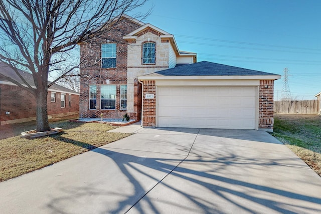 view of front property featuring a garage and a front yard