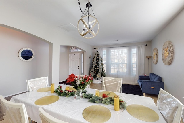 dining area featuring an inviting chandelier