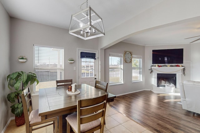 tiled dining area with ceiling fan