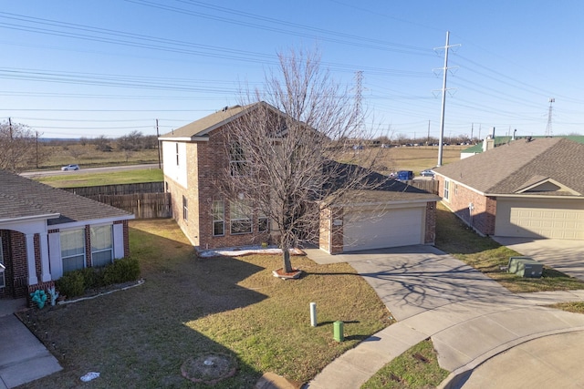 view of front facade with a front yard and a garage