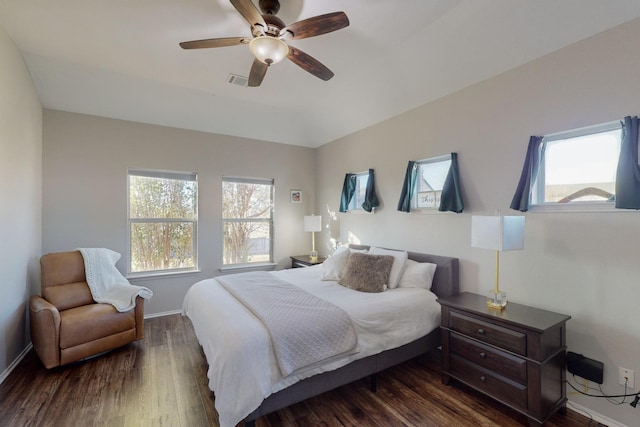 bedroom featuring ceiling fan and dark hardwood / wood-style flooring