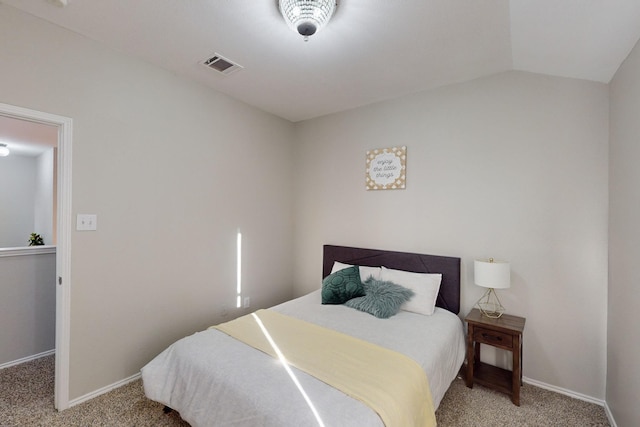 carpeted bedroom featuring lofted ceiling