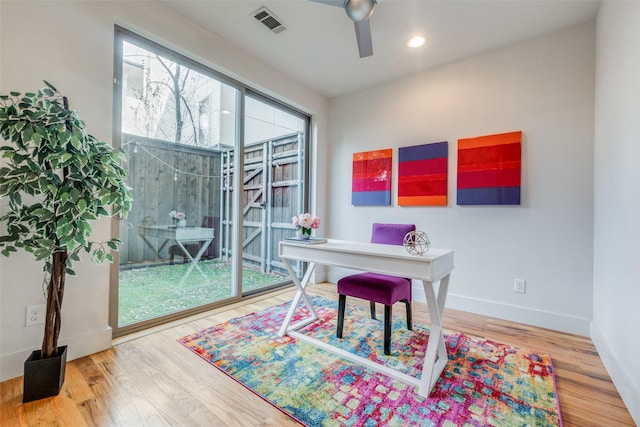 office space with ceiling fan and hardwood / wood-style floors