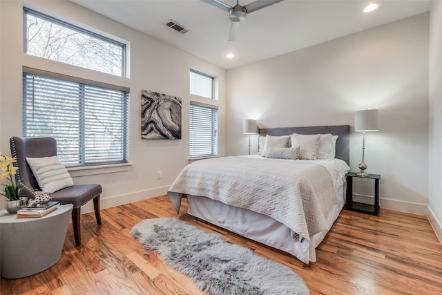 bedroom with ceiling fan and light wood-type flooring