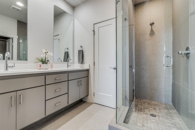 bathroom featuring an enclosed shower and vanity