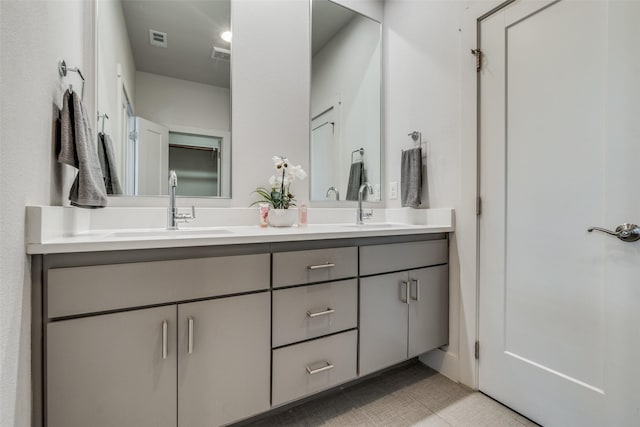 bathroom with tile patterned flooring and vanity