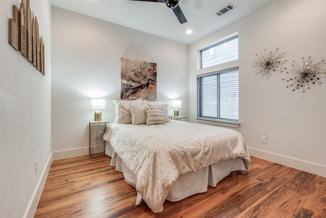 bedroom with ceiling fan and wood-type flooring