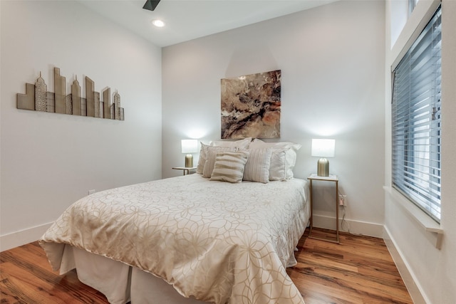 bedroom featuring ceiling fan and hardwood / wood-style floors