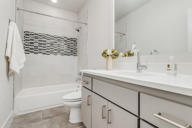 full bathroom featuring toilet, vanity, and tiled shower / bath combo