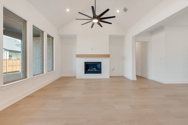 unfurnished living room featuring ceiling fan, high vaulted ceiling, and light hardwood / wood-style flooring