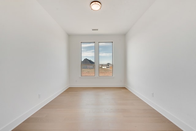 unfurnished room featuring light hardwood / wood-style floors