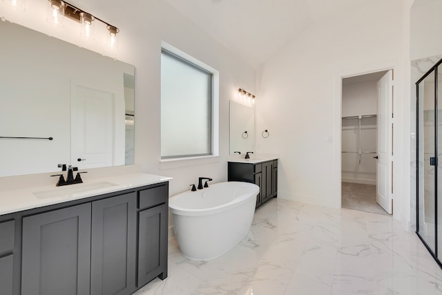 bathroom with lofted ceiling, vanity, and shower with separate bathtub