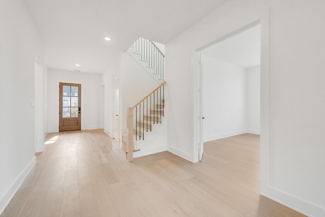 entrance foyer with light hardwood / wood-style flooring