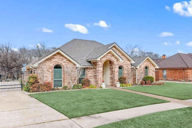 view of front of home with a front lawn