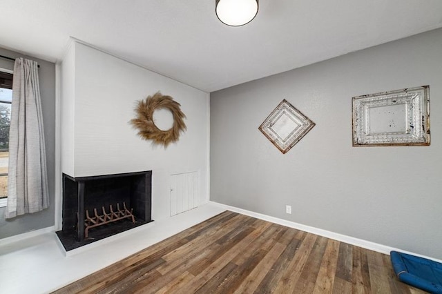 unfurnished living room with hardwood / wood-style floors