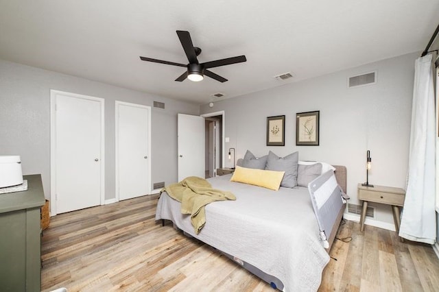 bedroom with ceiling fan and hardwood / wood-style flooring