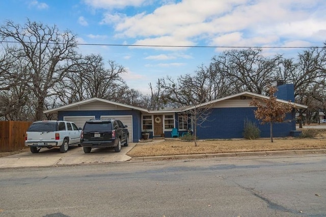 ranch-style house featuring a garage