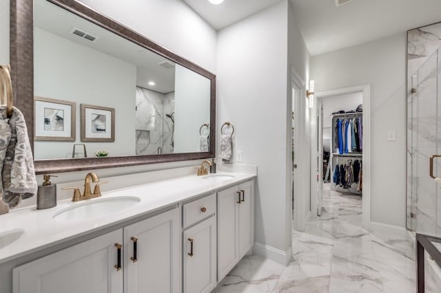 bathroom with an enclosed shower and vanity