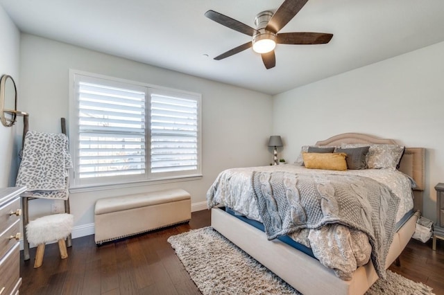 bedroom featuring ceiling fan and dark hardwood / wood-style floors