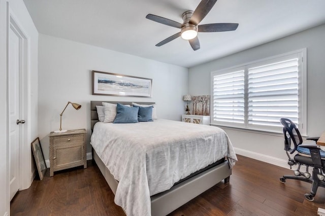 bedroom with dark wood-type flooring and ceiling fan