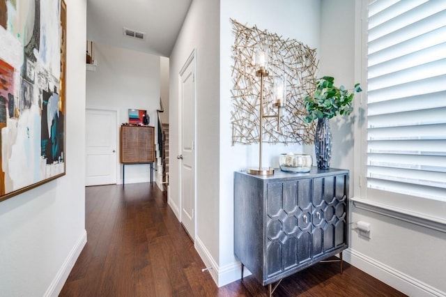 hallway featuring dark wood-type flooring