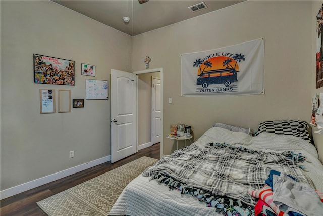 bedroom featuring dark hardwood / wood-style floors