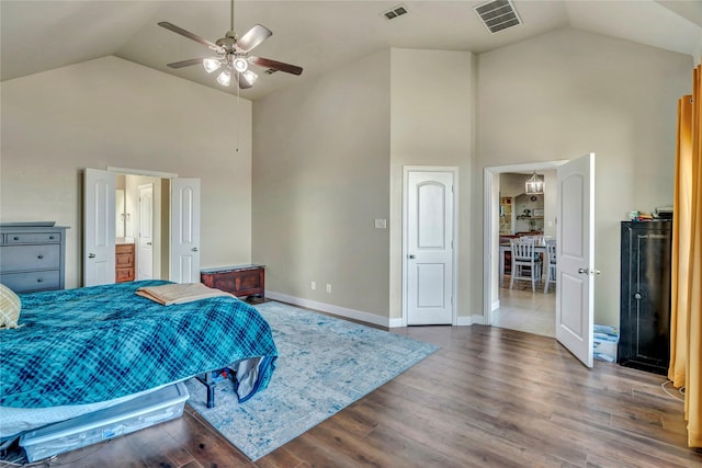 bedroom featuring ceiling fan, hardwood / wood-style floors, and high vaulted ceiling