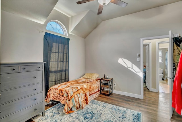 bedroom with ceiling fan, lofted ceiling, and hardwood / wood-style floors