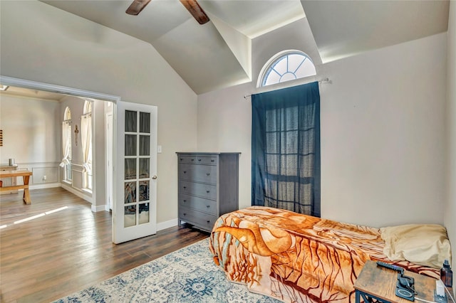 bedroom with vaulted ceiling, ceiling fan, and hardwood / wood-style floors