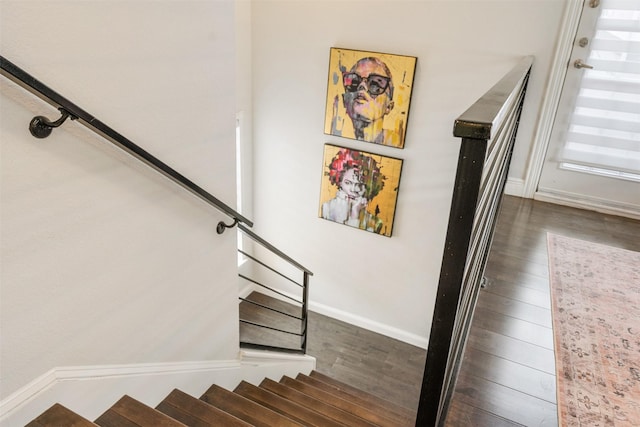 stairs with hardwood / wood-style floors