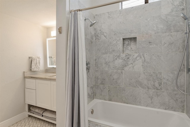 bathroom featuring shower / bath combo with shower curtain, a healthy amount of sunlight, tile patterned floors, and vanity