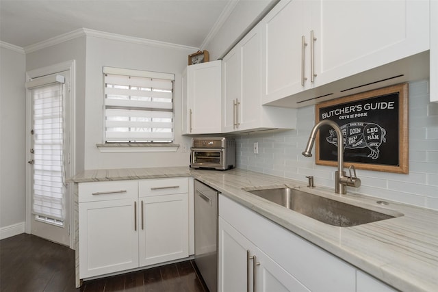 kitchen with sink, light stone counters, white cabinets, and stainless steel dishwasher