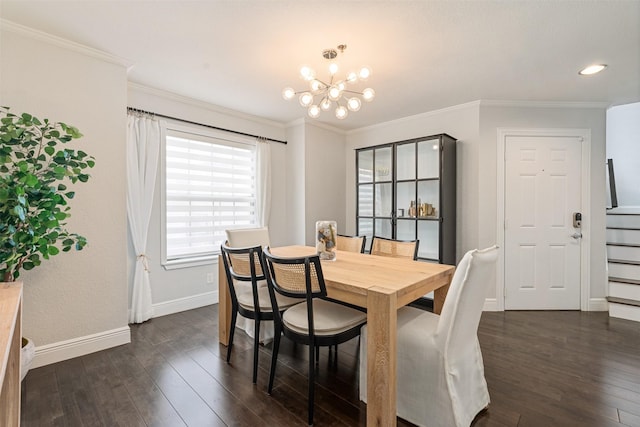 dining area with dark hardwood / wood-style flooring, crown molding, and a chandelier