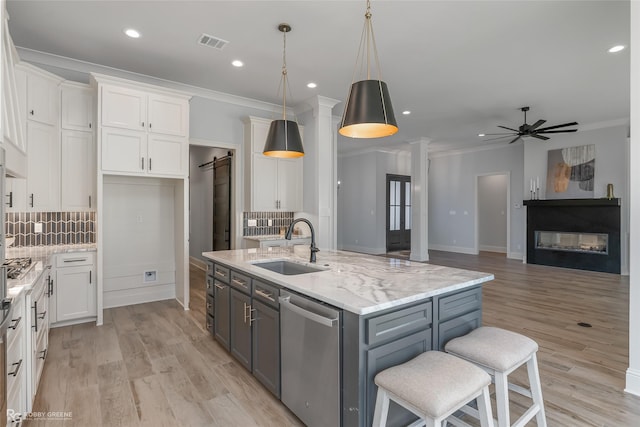 kitchen with stainless steel appliances, gray cabinets, white cabinets, and visible vents