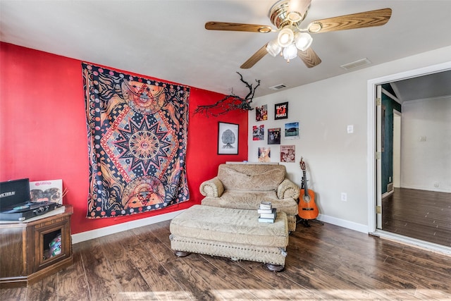 sitting room featuring ceiling fan and wood-type flooring