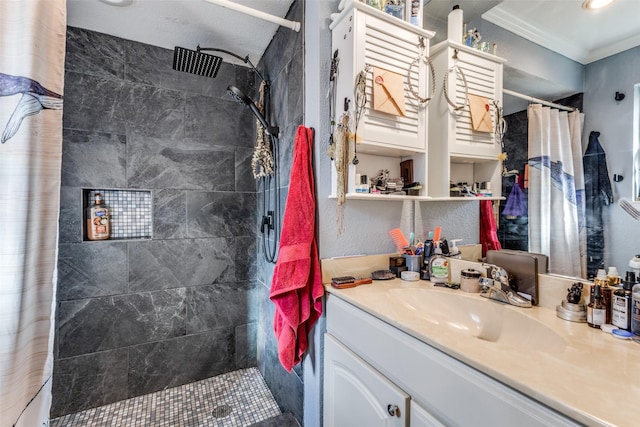 bathroom featuring curtained shower, vanity, and crown molding