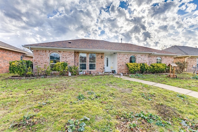 single story home with a front yard