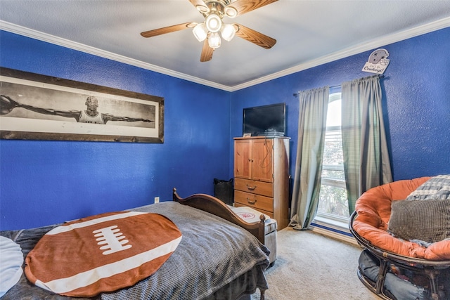 bedroom featuring ceiling fan, crown molding, and carpet floors