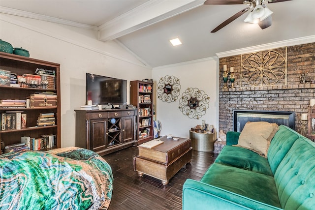 living room with lofted ceiling with beams, a fireplace, dark hardwood / wood-style flooring, and ornamental molding