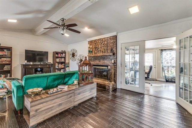 living room with ceiling fan, a brick fireplace, lofted ceiling with beams, french doors, and dark hardwood / wood-style flooring