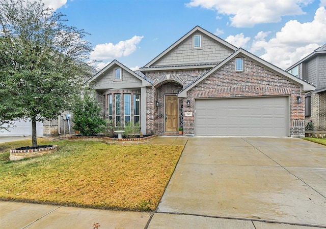 view of front of house with a garage and a front lawn