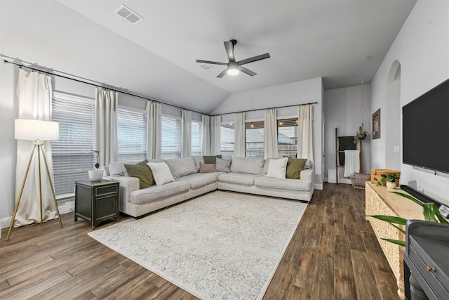 living room with lofted ceiling, hardwood / wood-style floors, and ceiling fan