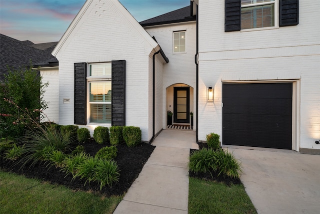 view of front of property with a garage