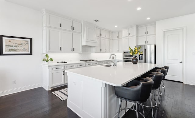 kitchen featuring sink, white cabinets, and stainless steel appliances