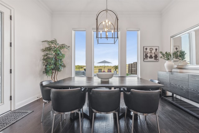 dining area featuring an inviting chandelier, dark hardwood / wood-style flooring, and ornamental molding